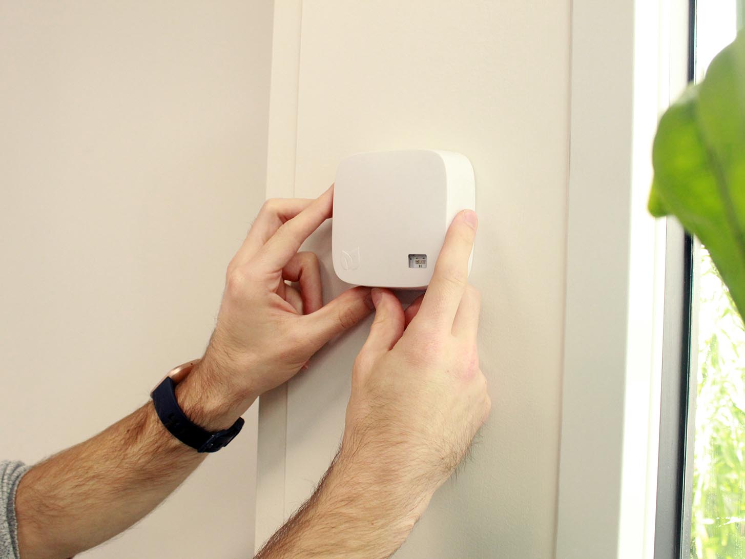 Thumbnail of An AirSuite sensor being mounted on a wall